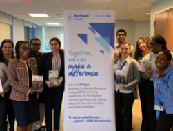Group of people near a banner
